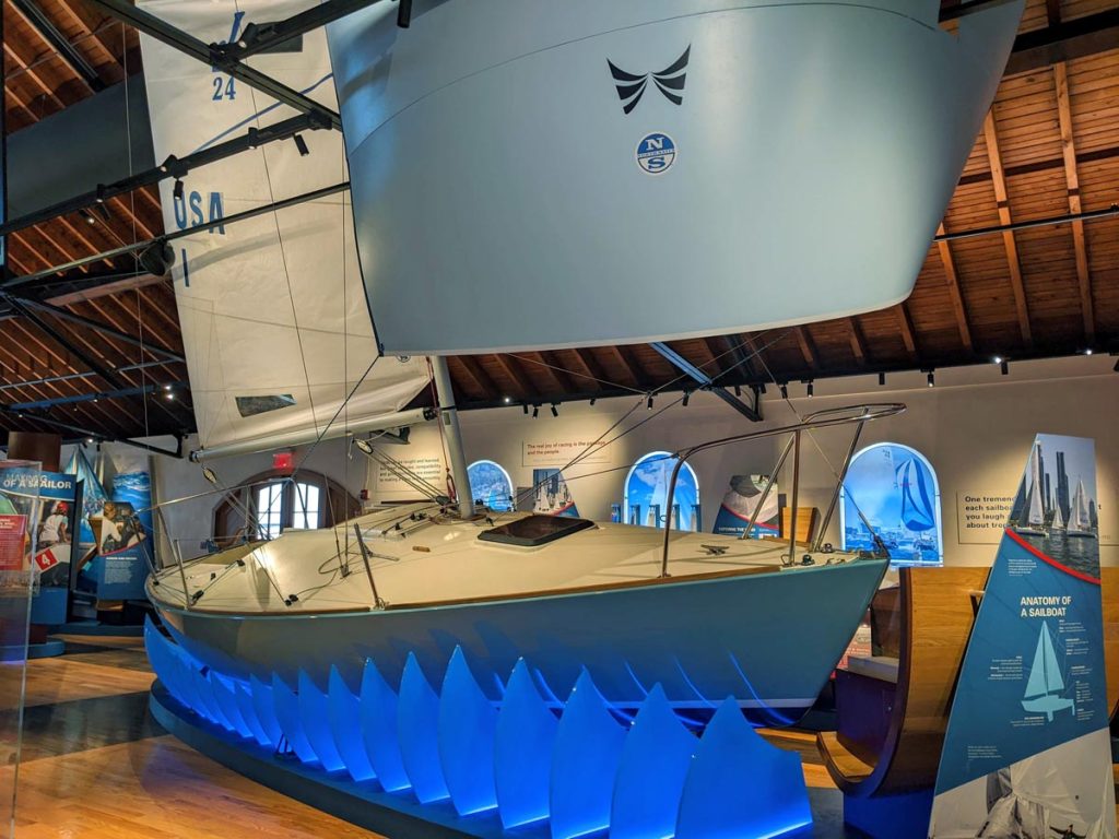 Exhibit of a full size sailboat with interactive display at the Sailing Museum in Newport, RI