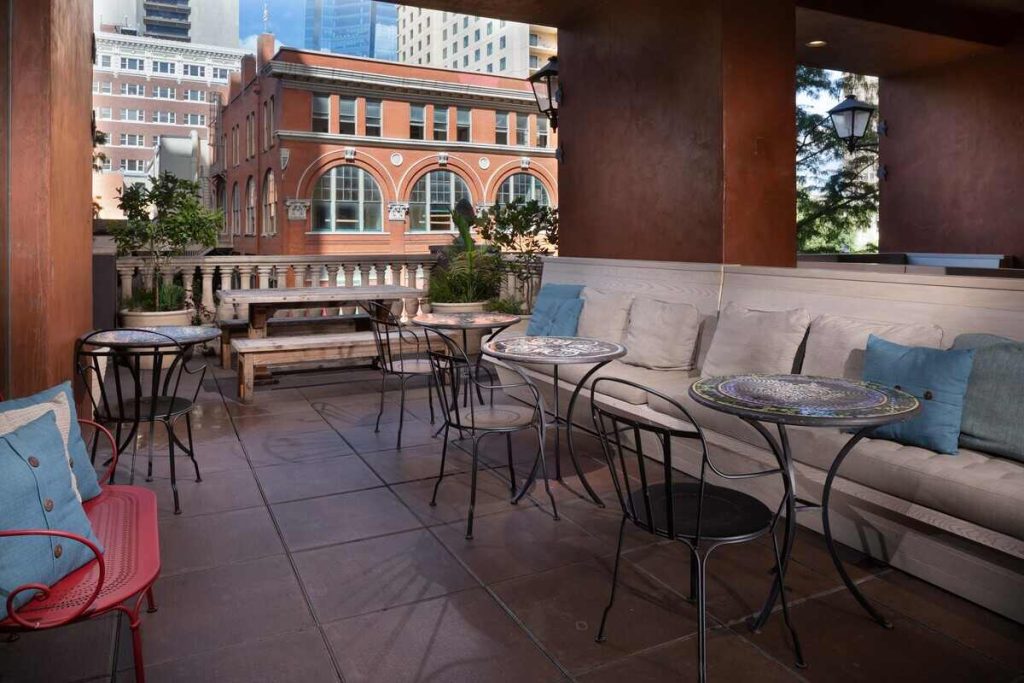 Terrace with river views, featuring comfortable sofas and tables 