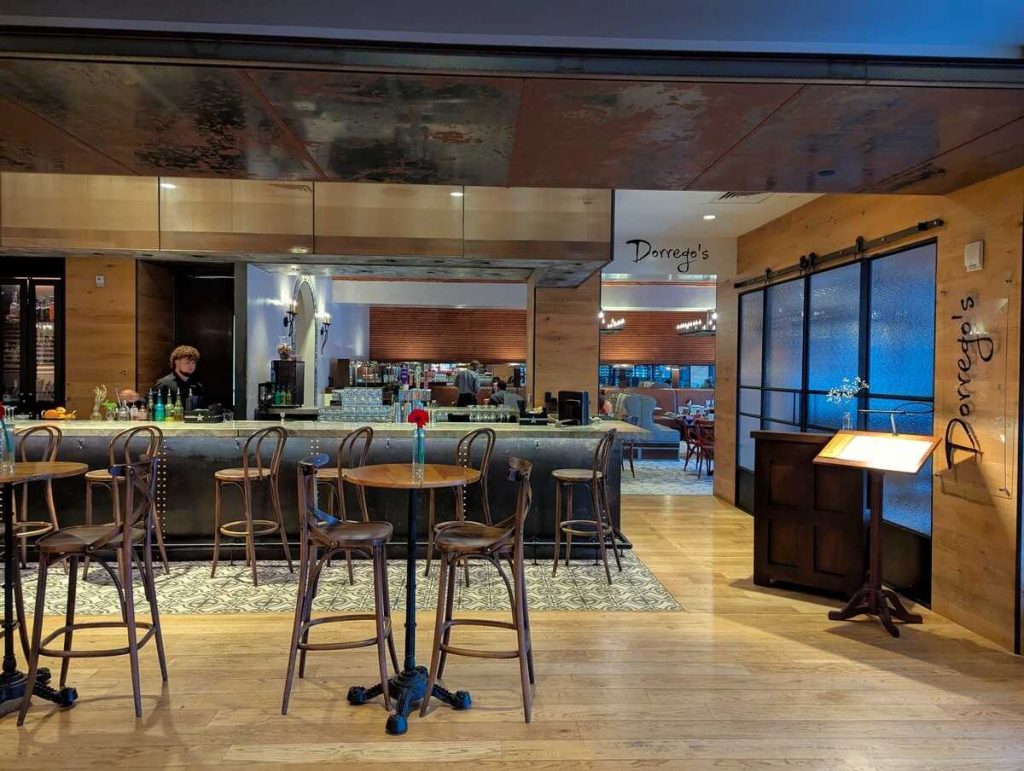 Sleek bar with Spanish colonial style furniture and encaustic tile