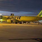 A Spirit Airlines plane sits at the gate overnight.